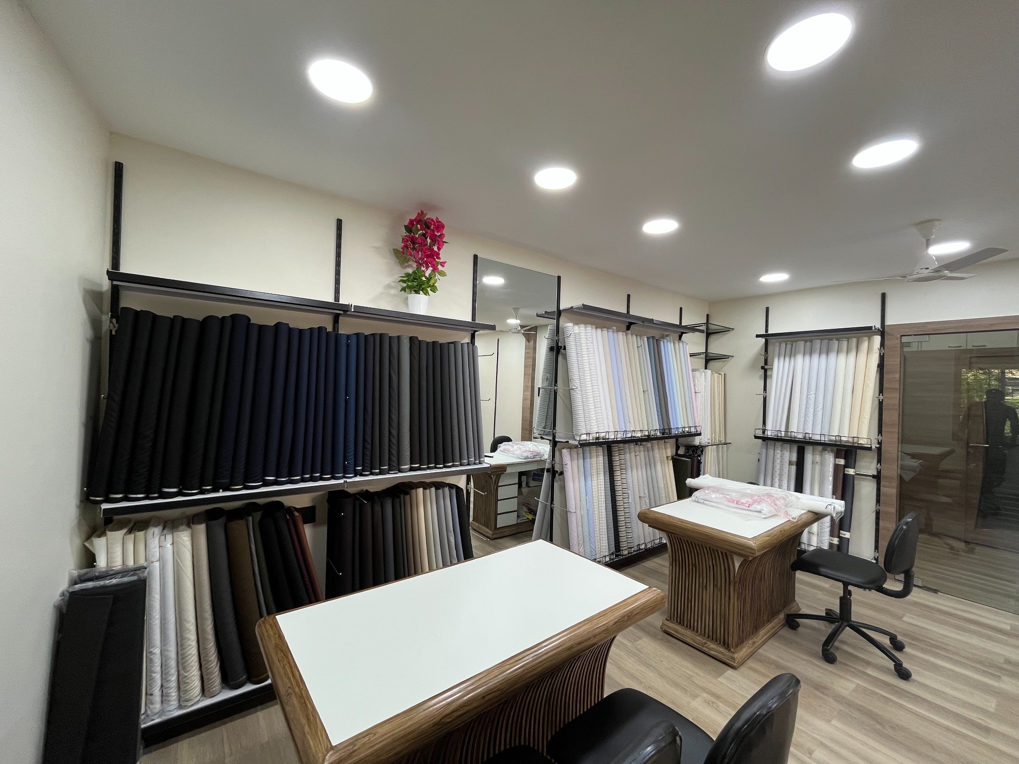 Woolco premium suiting fabric showroom in South Mumbai, with fabric rolls on display